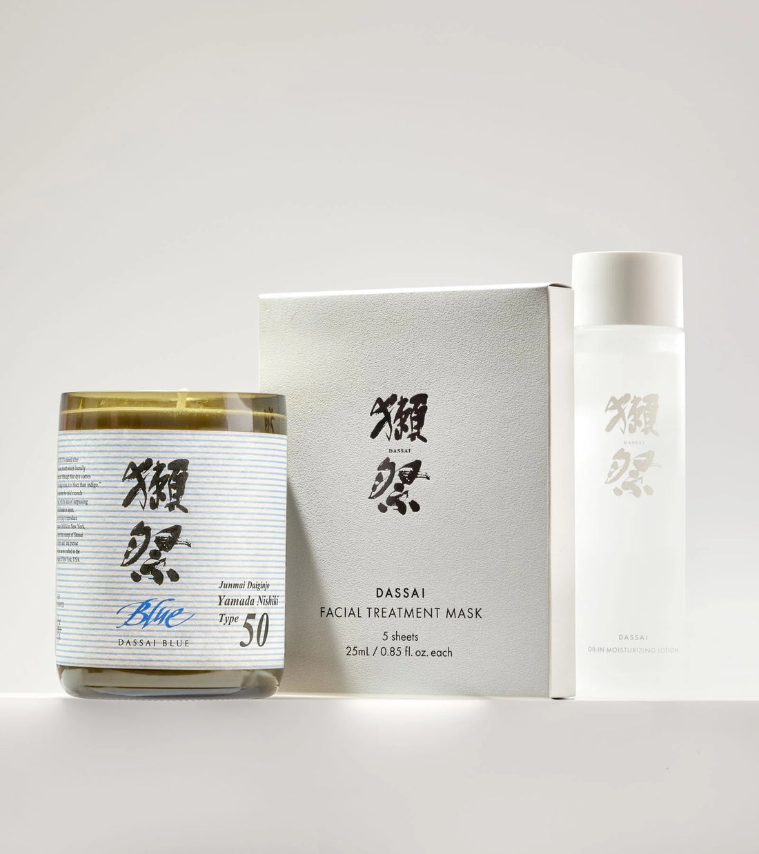 Dassai Sake Skincare Gift Set | Facial Mask box, Oil-in Moisturizing Lotion bottle, and Dassai candle together in gift presentation